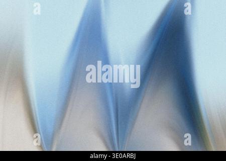 A close-up, abstract image featuring a wavy or zigzag pattern in shades of light and medium blue. The surface has a noticeable grainy or noisy texture Stock Photo
