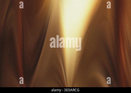 A close-up abstract image featuring a rich brown, textured surface, possibly leather or heavy fabric, dramatically illuminated by a bright, central go Stock Photo