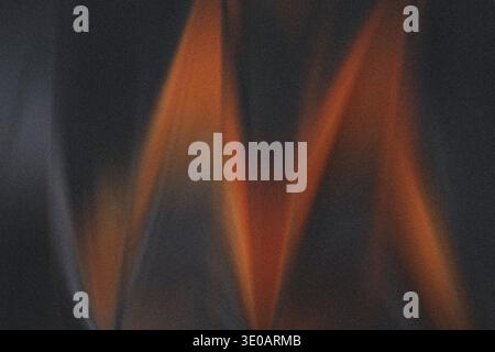 A striking abstract image dominated by a bright orange zigzag pattern resembling spray paint or a light streak against a very dark, heavily textured, Stock Photo
