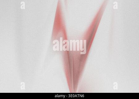A minimalist abstract composition featuring a V-shaped pattern created by fine red sand, sharply contrasted against a pure white, textured background. Stock Photo