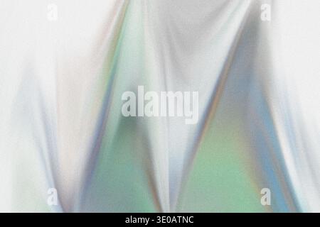 A highly textured abstract background showcasing soft, iridescent colors, primarily greens and blues, appearing as if light is passing through a folde Stock Photo