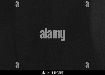 A detailed, dark black textured background, possibly resembling leather or a heavily grained material. The surface is uniform in color but shows fine, Stock Photo