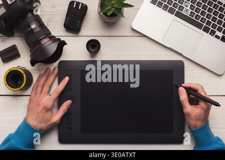 Designer hand working with graphic tablet Stock Photo