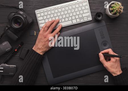 Designer hand with graphic tablet and keyboard Stock Photo