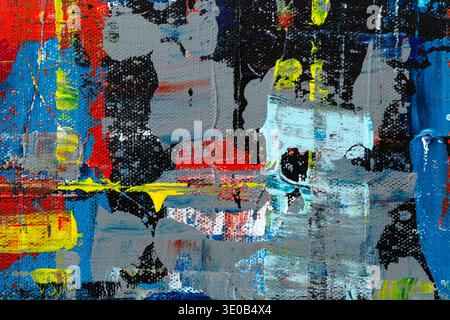 Macro close-up of an abstract, messy, bright and colorful acrylic paint background. High resolution full frame textured canvas background. Stock Photo