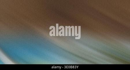 A grainy abstract background with a gradient of brown, blue, and green creates a textured and blurred effect Stock Photo