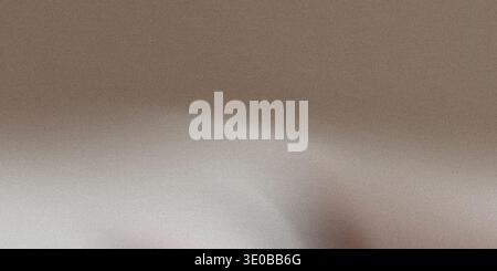 A textured beige background with a subtle gradient creates a neutral and versatile surface Stock Photo