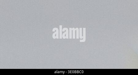 A grainy gray texture creates an abstract background with a subtle noise pattern Stock Photo