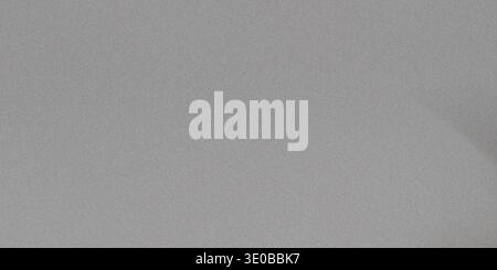A subtle gray grainy texture creates a versatile abstract background with a rough, vintage feel Stock Photo