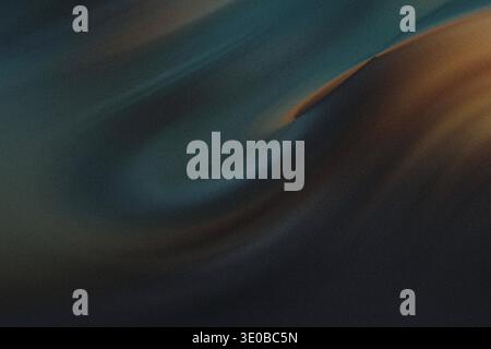 A grainy abstract background showcases a swirling gradient of dark and golden shades, evoking a sense of depth and mystery Stock Photo