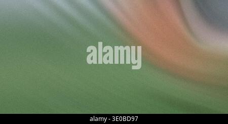 An abstract background with a gradient of green and white hues creates a soft and vibrant textured pattern Stock Photo