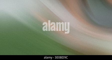 A blurred abstract background with a gradient of green and white hues creates a soft and vibrant textured pattern Stock Photo