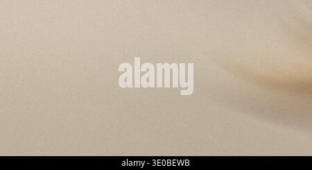 A soft beige texture provides a neutral background with a subtle grain and gentle light Stock Photo