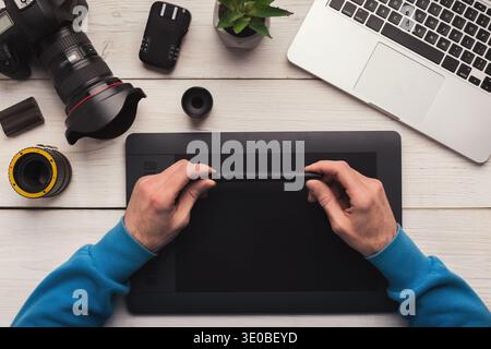 Designer hand working with graphic tablet Stock Photo