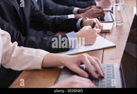 Businessman in suit putting signature on contract Stock Photo
