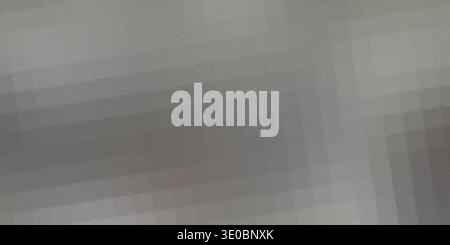 A soft, grainy, abstract background with subtle horizontal lines and a gradient from light gray to darker gray, creating a textured and atmospheric vi Stock Photo