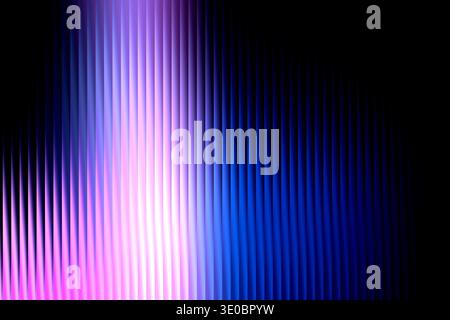 Abstract background with vertical lines of light in shades of pink, purple, and blue fading into black Stock Photo