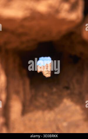 Rock Window View to Sandstone Formations in Cathedral Gorge State Park Stock Photo