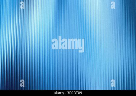 A textured blue background with vertical ribbed patterns and a soft, luminous gradient Stock Photo