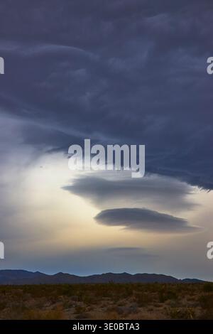 Storm Clouds and Lenticular Formations Over Nevada Desert Landscape Stock Photo