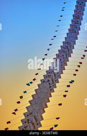 Playing Card Kites Colorful Pennants and Golden Hour Sky at Las Vegas Kite Festival Stock Photo