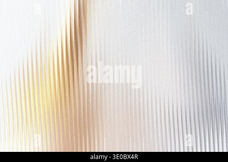 A shimmering abstract background with vertical golden and silver lines, creating a textured and luminous effect Stock Photo