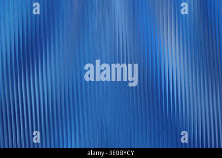 A textured blue background with vertical ribbed patterns and a subtle gradient effect Stock Photo