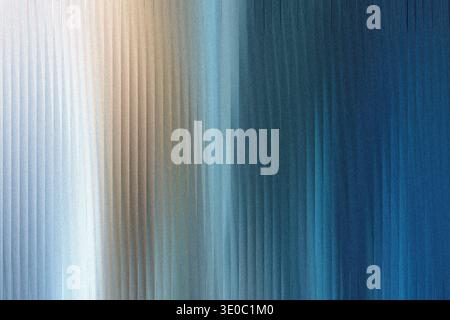 A textured abstract background features a gradient of cool blue and warm beige tones, with vertical lines creating a sense of depth and movement Stock Photo