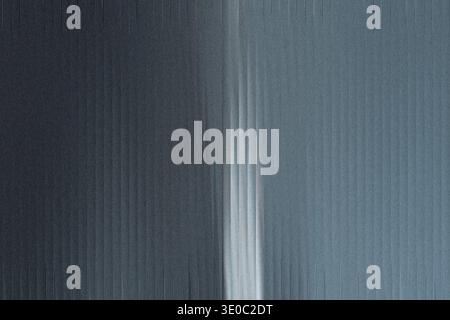 A closeup view reveals a textured metallic surface with vertical grooves and a subtle gradient from dark gray to lighter bluegray, creating a modern i Stock Photo