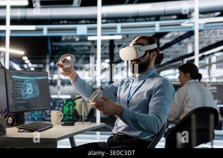 Data center admin wearing VR equipment using artificial intelligence neural networks technology. Server room employee using virtual reality headset and AI programming language to configure hardware Stock Photo