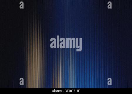 Abstract vertical lines of light and shadow create a textured, futuristic background with a deep blue hue and a subtle golden glow Stock Photo
