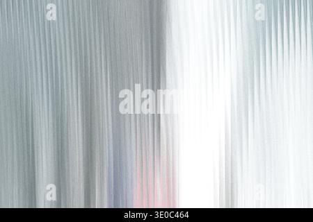 Abstract vertical lines with a subtle gradient from light gray to white, creating a textured and modern background Stock Photo