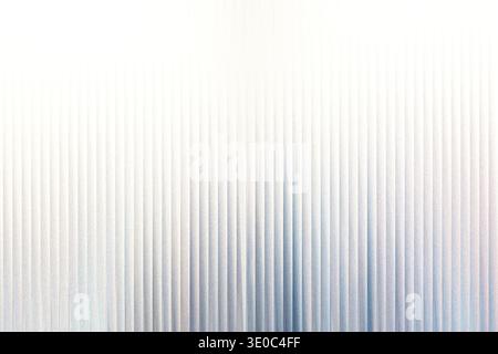 A subtle abstract background features vertical lines with a soft gradient from white to pale blue, creating a serene and minimalist texture Stock Photo