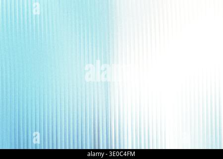 A soft, textured background with vertical lines fading from a light blue hue to a bright white Stock Photo