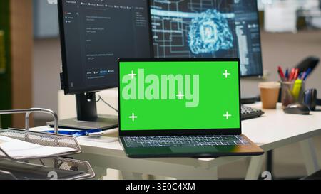 Isolated screen laptop in empty AI startup office displaying programming languages used for building applications. Chroma key notebook showing deep learning code in software development agency Stock Photo