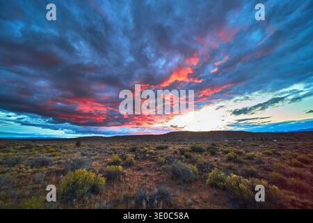 Vivid Sunset Clouds Over Desert Landscape in Cathedral Gorge State Park Nevada Stock Photo