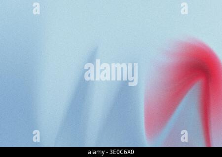 Close-up abstract image featuring a textured, light blue surface with a vibrant red spray paint mark bleeding into the texture on the right side. The Stock Photo