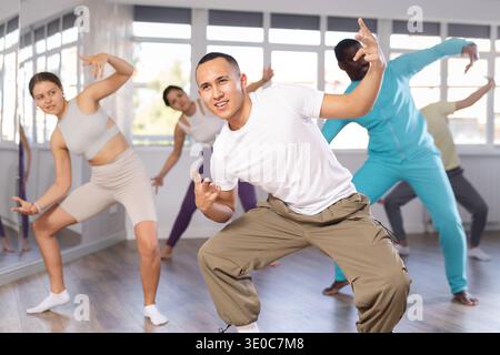 Young Asian man practicing modern street dancing in studio Stock Photo