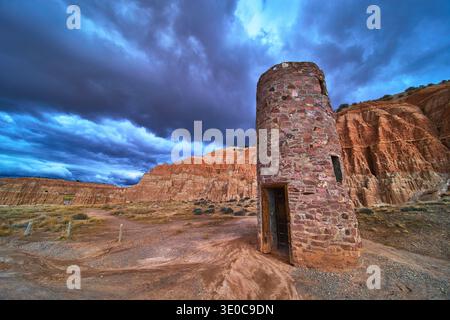 Abandoned CCC Water Tower and Dramatic Cliffs in Cathedral Gorge State Park Nevada Stock Photo