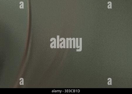 A blurry close-up shot reveals a wall painted in a muted olive green shade. The surface displays an uneven texture with subtle discoloration and a thi Stock Photo