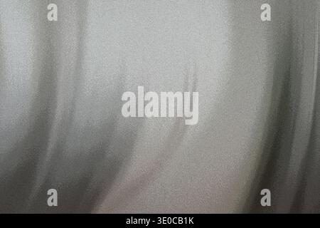A detailed close-up shot reveals the subtle texture and folds of a draped white fabric. The image showcases the play of light and shadow on the materi Stock Photo