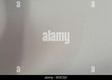 An out-of-focus image shows a light grey surface with a slightly textured appearance. The overall impression is of a soft, muted tone and indistinct d Stock Photo
