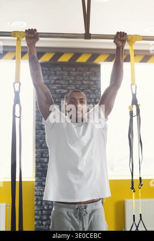 Man doing pull up exercise on horizontal bar Stock Photo