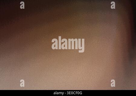 A blurry image showing a gradient transition from a darker brown to a lighter brown. The texture is smooth with subtle variations in tone. Stock Photo