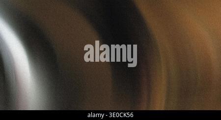 An abstract image featuring a blurred blend of brown, gray, and muted gold tones creating a smooth, flowing effect. Stock Photo