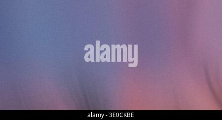 A softly blurred image showcasing a gradient blend of dusty rose and periwinkle shades, creating a serene and dreamy atmosphere. Stock Photo