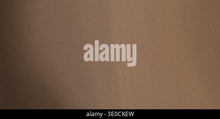 A simple image featuring a subtle gradient of brown shades, creating a smooth and understated background texture. Stock Photo