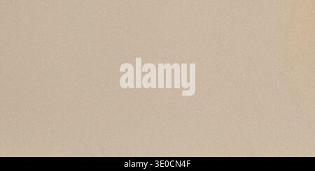 A high-resolution image featuring a uniform, light beige color. Ideal for backgrounds or simple designs. Stock Photo