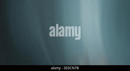 A blurry image featuring a vertical gradient blend of teal and white hues. The texture is smooth with subtle variations in tone. Stock Photo