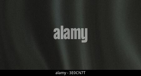 A close-up shot of dark grey fabric with subtle folds and wrinkles, creating a textured background. The image is slightly blurred, giving it a soft, d Stock Photo